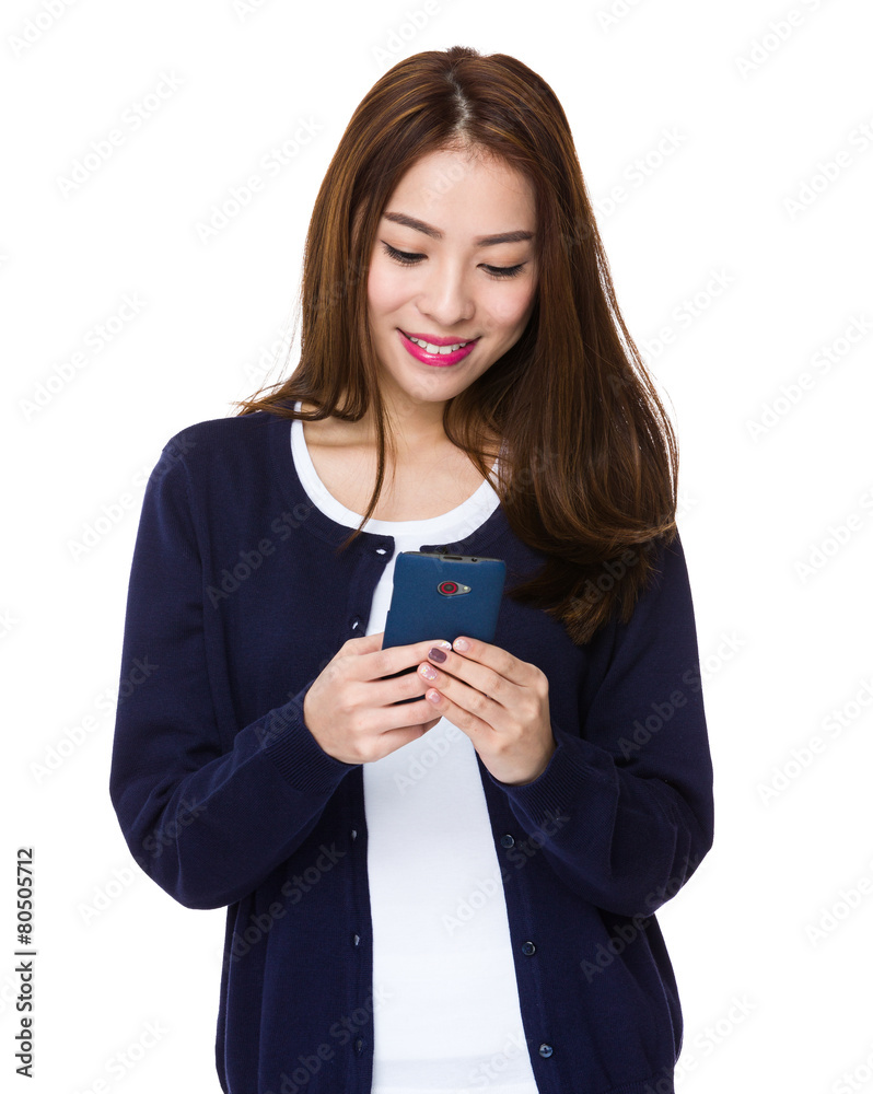 Chinese woman texting with cell phone Chinese woman texting with cell phone