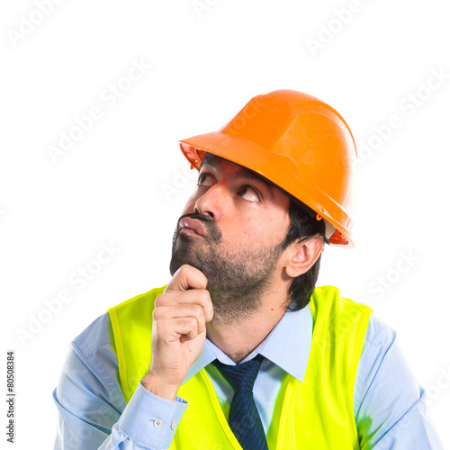 Workman thinking over white background