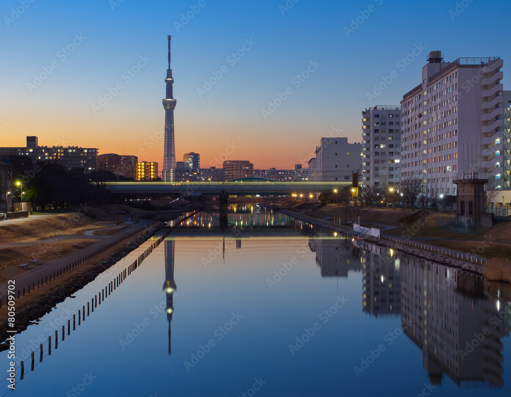 Tokyo Sky tree with refection in evening .