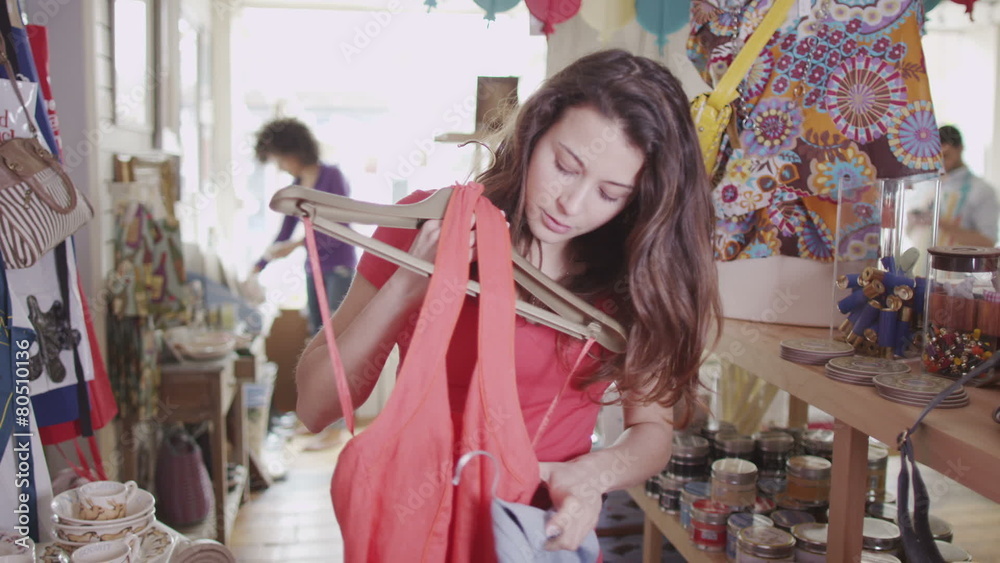 Attractive young woman shopping for new clothes Attractive young woman shopping for new clothes