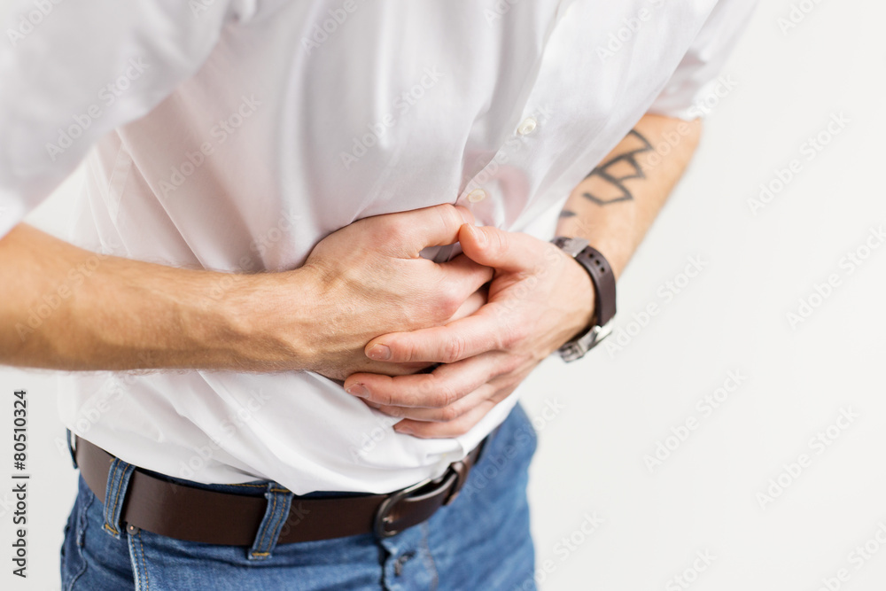 Young man having stomach pain Young man having stomach pain