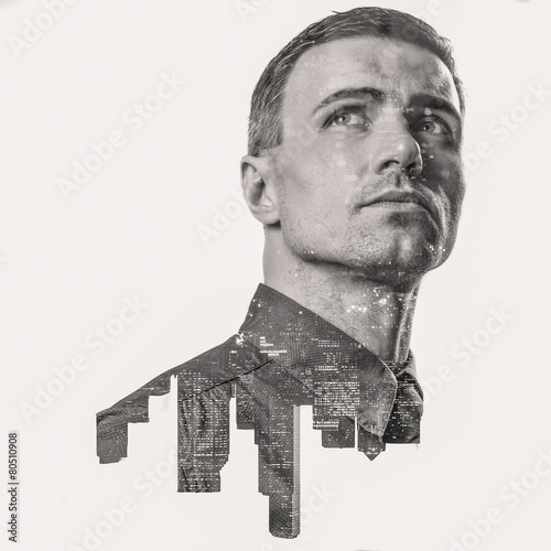 Double exposure of a city and businessman portrait looking up