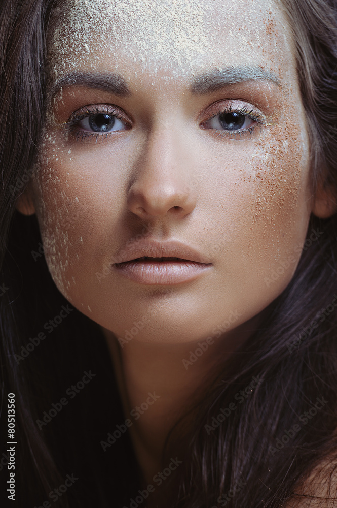 Fototapeta premium Young beautiful woman in nature makeup powder