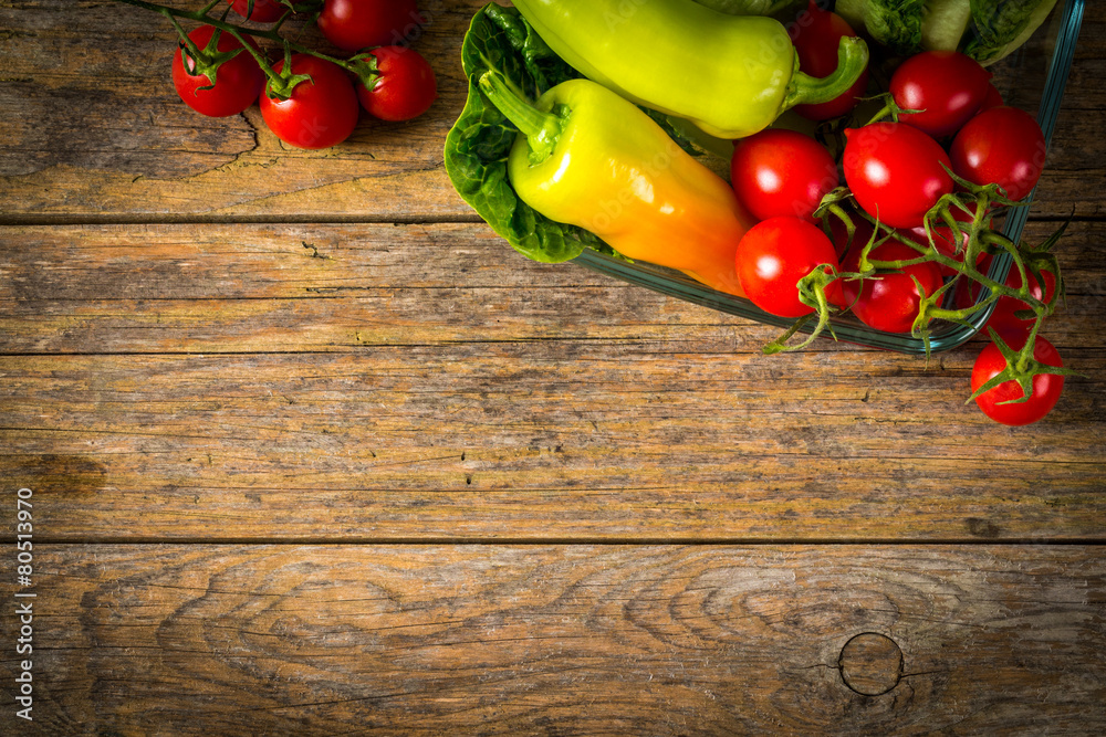 Red tomato, yellow pepper and green salad on wooden table. Red tomato, yellow pepper and green salad on wooden table.
