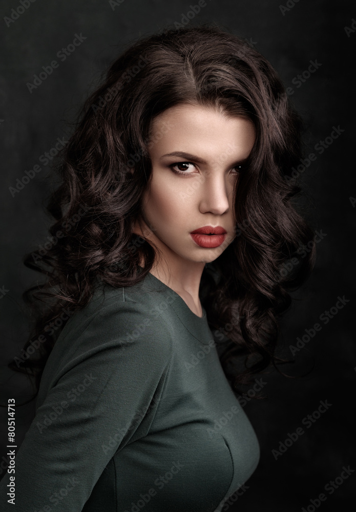 Classic portrait of a beauty woman in a green dress over green b Classic portrait of a beauty woman in a green dress over green b