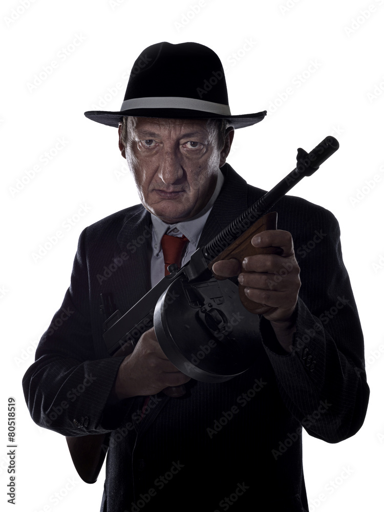 Old style gangster with tommy gun, on white background Old style gangster with tommy gun, on white background