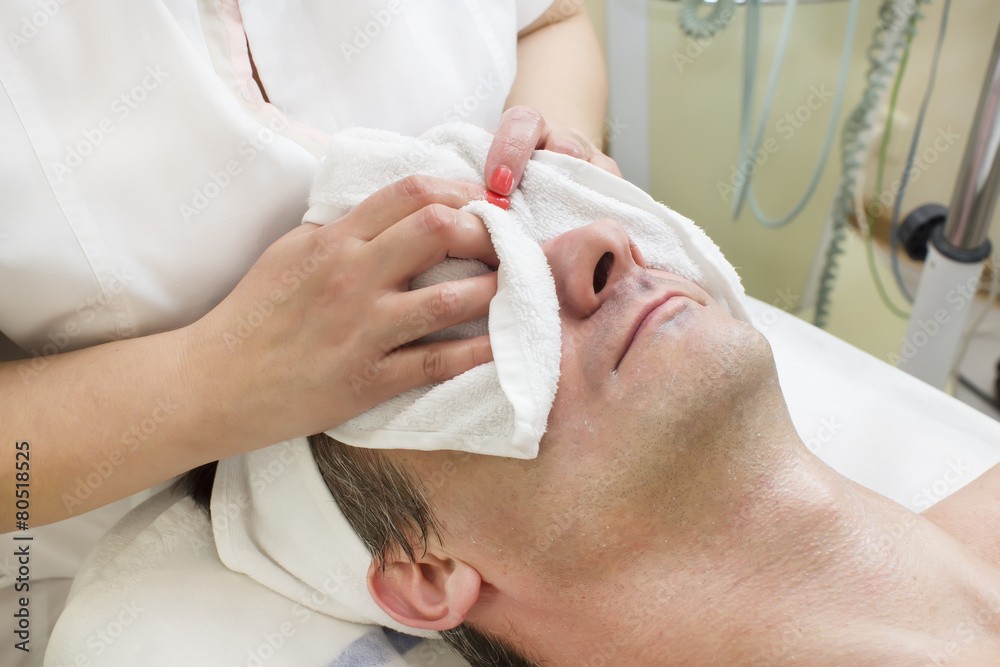 man in a beauty salon facial and massage man in a beauty salon facial and massage