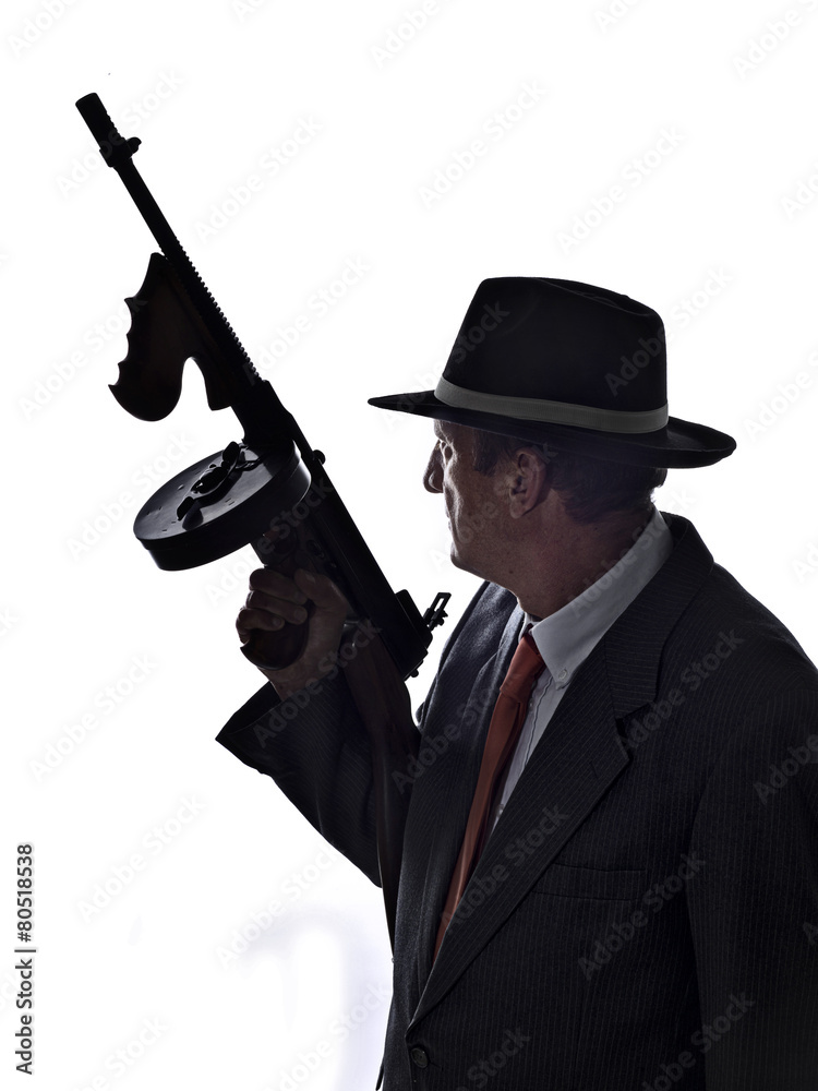 Old style gangster with tommy gun, on white background