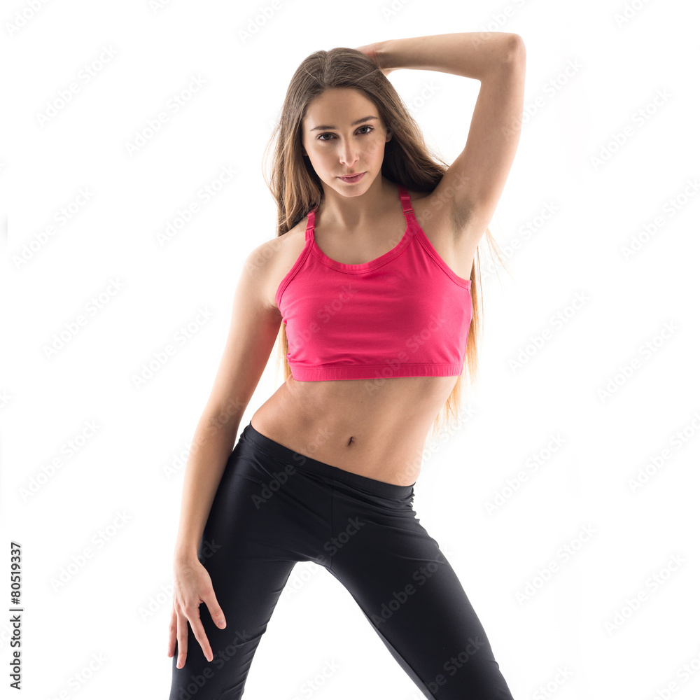 Sensual sporty young woman isolated against white background. St Sensual sporty young woman isolated against white background. St