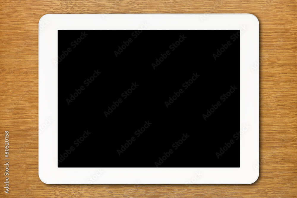 White Tablet PC with black screen on the table White Tablet PC with black screen on the table