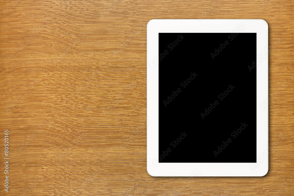 White Tablet PC with black screen on the table White Tablet PC with black screen on the table