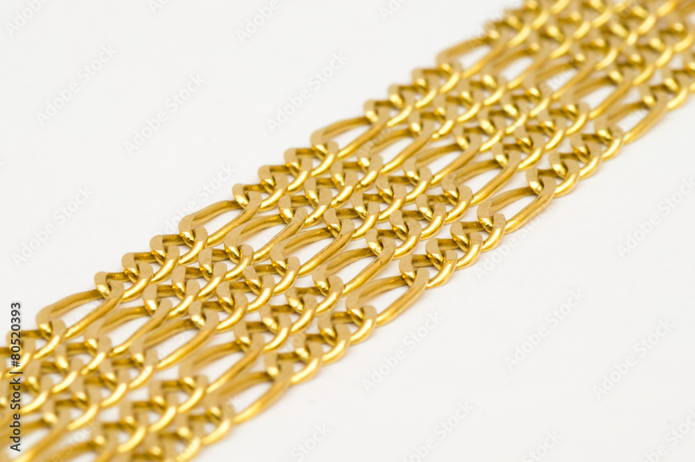 Fototapeta premium Gold necklaces arranged nicely in a row