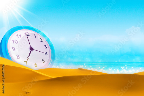 Time concept. Summer time. Alarm clock on the beach