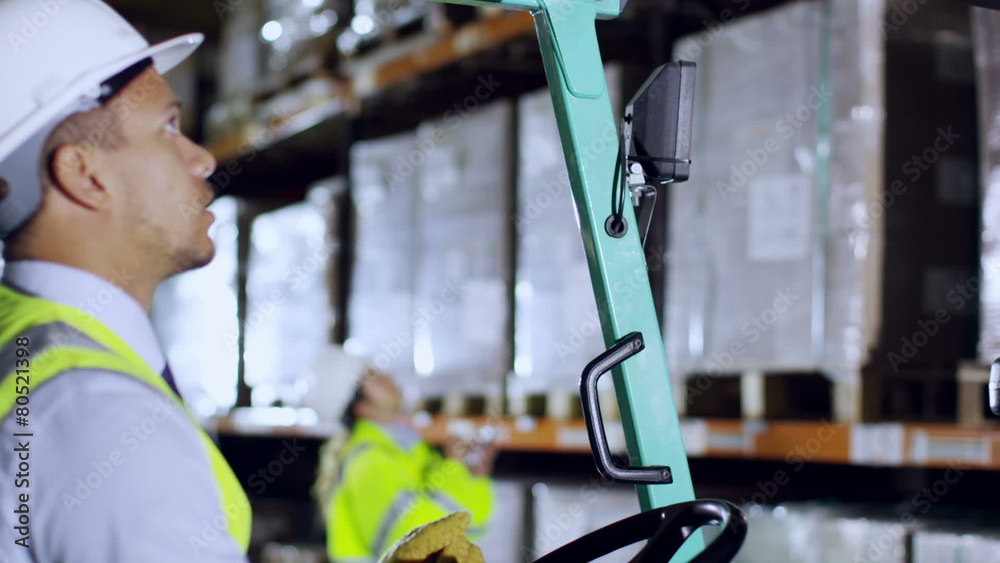 Team of industrial workers in a warehouse or factory Team of industrial workers in a warehouse or factory