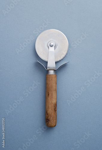 Картината върху платно Wooden pizza slicer