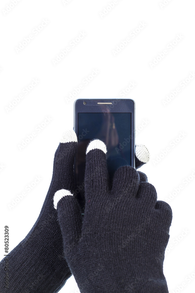 Closeup of woman hands with touchscreen gloves holding smart pho