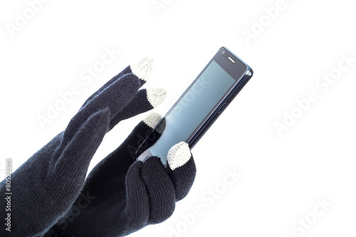 Obraz na płótnie Closeup of woman hands with touchscreen gloves holding smart pho w salonie