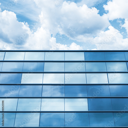  Blue mirrored glass and cloudy sky, office facade