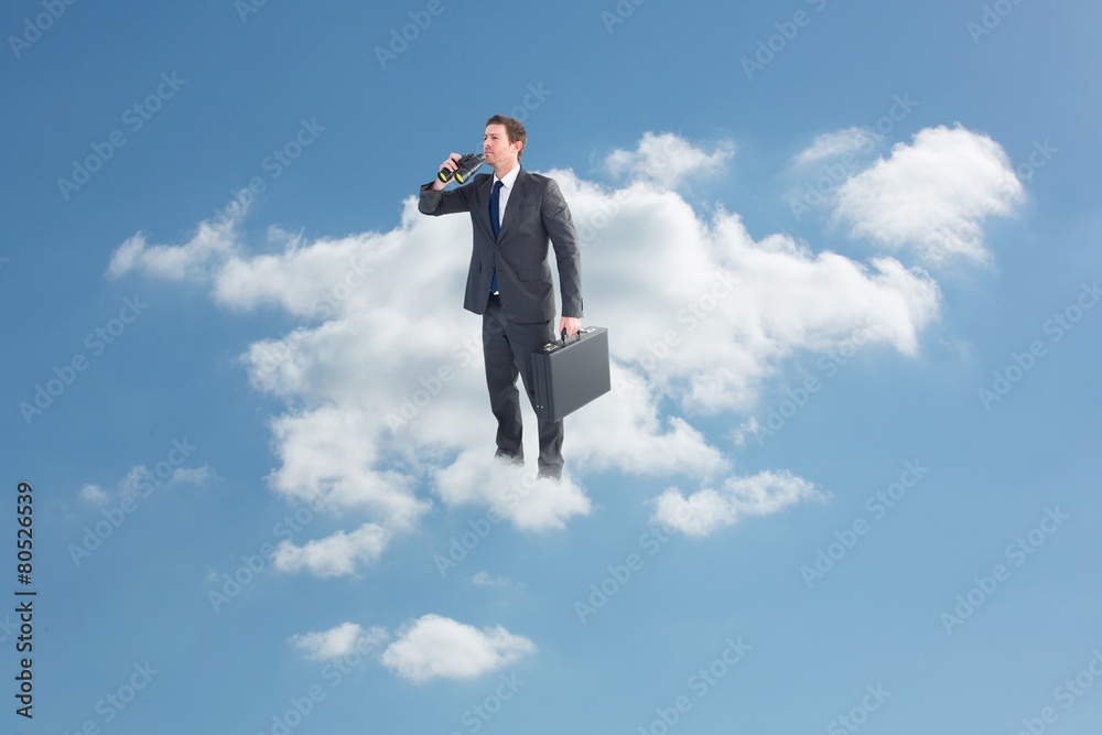 Composite image of businessman looking through binoculars Composite image of businessman looking through binoculars