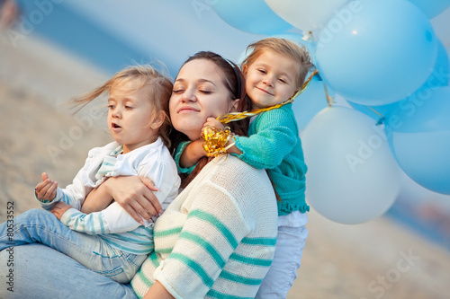 Happy family resting at beach 