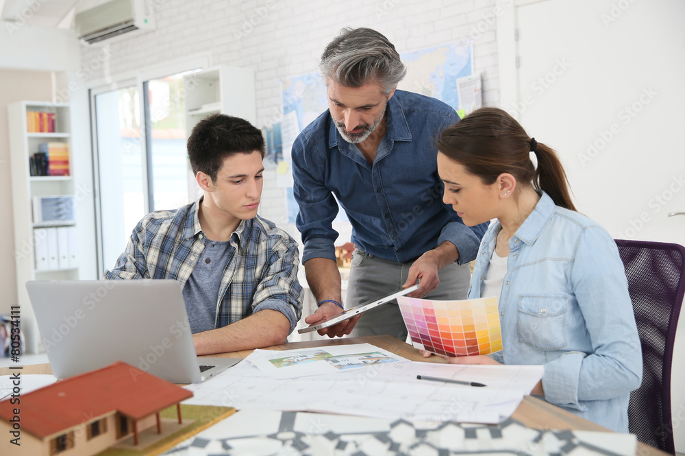 Teacher with students in architecture school Stock Photo | Adobe Stock