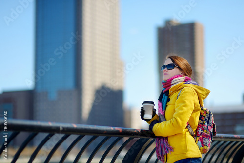 Beautiful young woman drinking coffee in New York