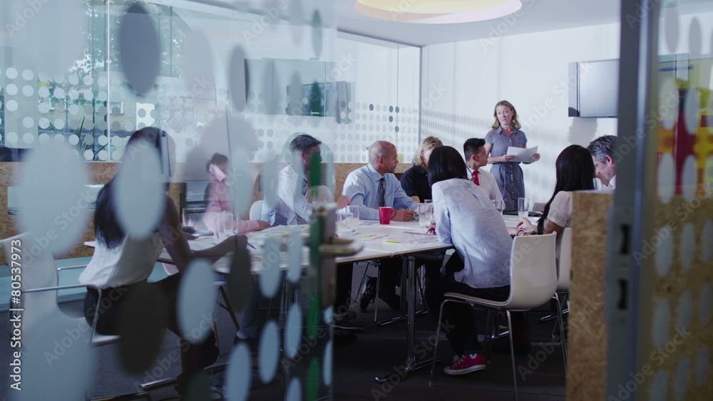 Attractive young mixed ethnicity business team in a boardroom meeting. Attractive young mixed ethnicity business team in a boardroom meeting.