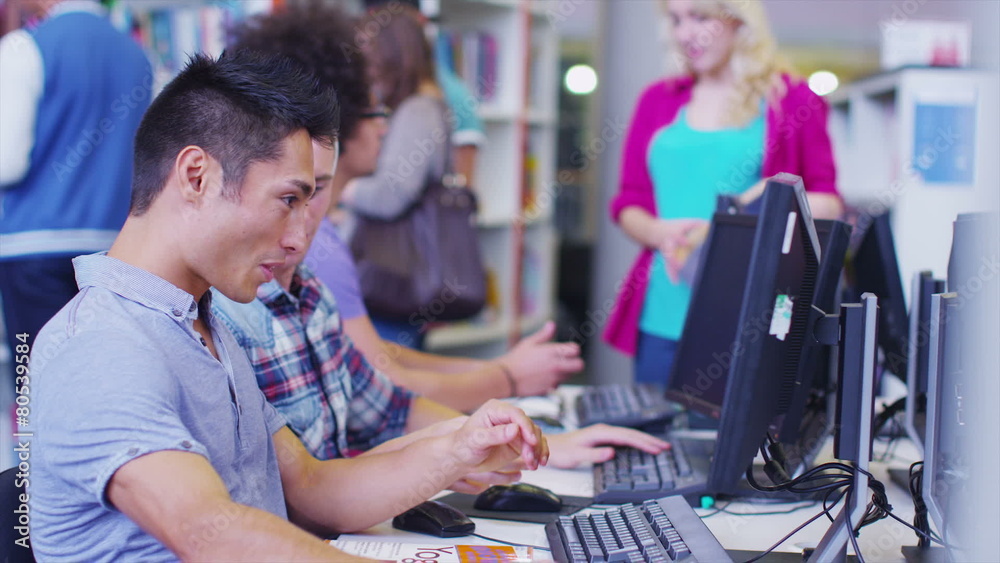 Diverse student group working and studying together in college library. Diverse student group working and studying together in college library.