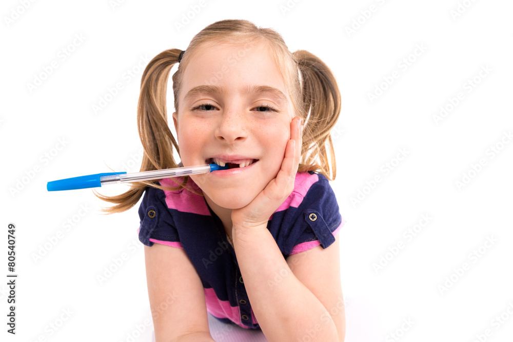 Blond kid girl student with spiral notebook in desk