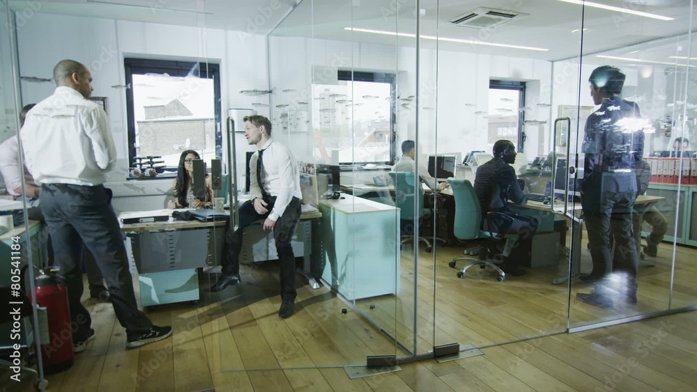 Young creative business team working together in a light contemporary office Young creative business team working together in a light contemporary office
