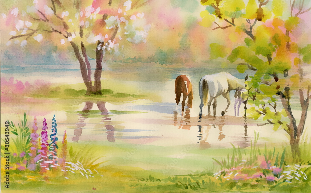 Fototapeta premium Two horses graze among the trees in the garden