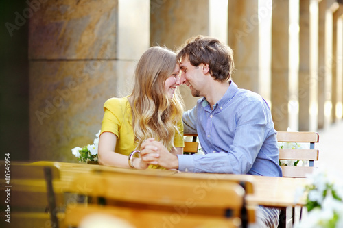 Young couple in the outdoor cafe