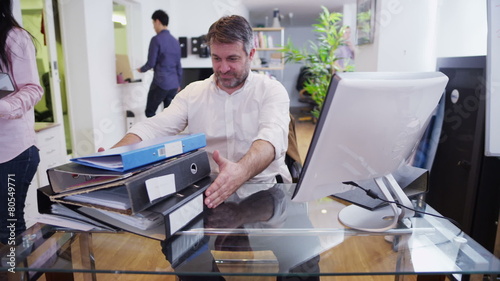 Time lapse of business people in a light and modern open plan office space