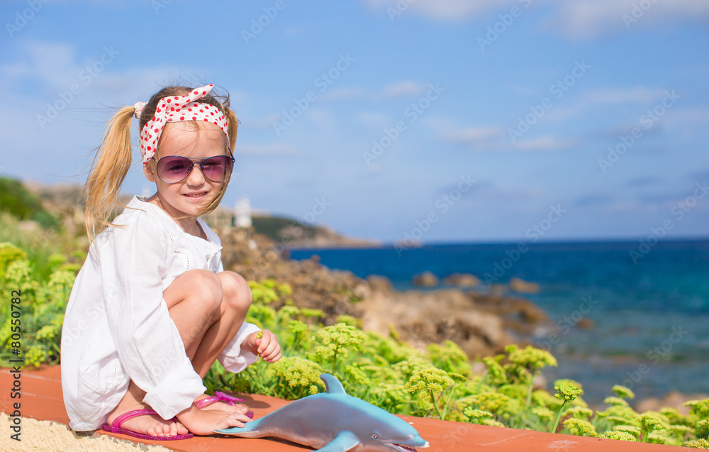 Adorable little girl outdoors during summer vacation