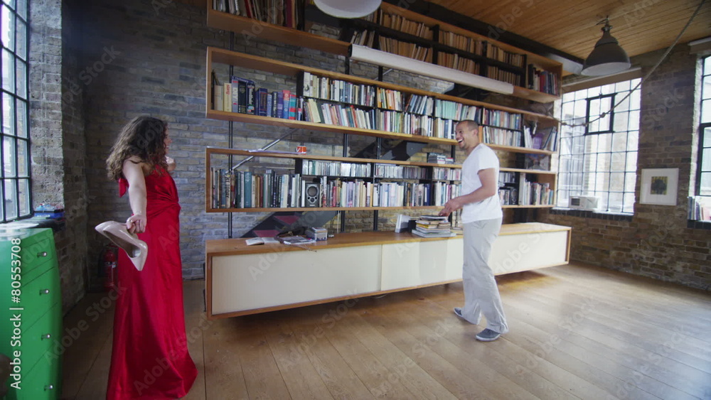 Beautiful woman in red dress dances with her partner Beautiful woman in red dress dances with her partner