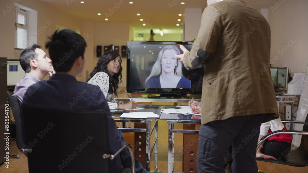 Young professional business team in a meeting via video call
