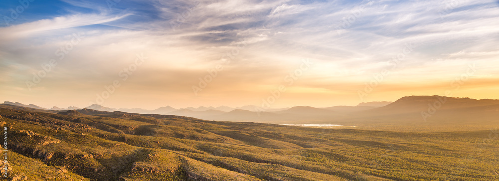 Panoramic wide view of sunset mountain landscape in stunning golden light in The Grampians, Australia