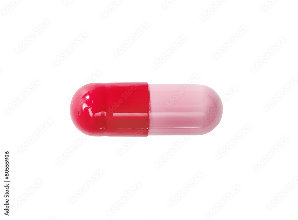 Macro red medical pill tablet isolated on white