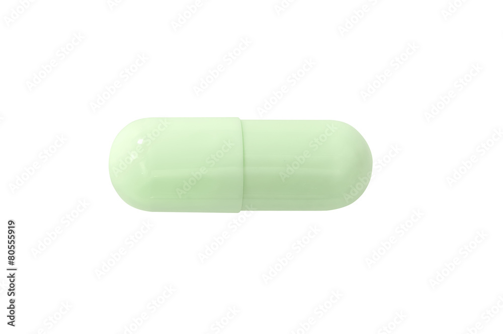 Macro green medical pill tablet isolated on white