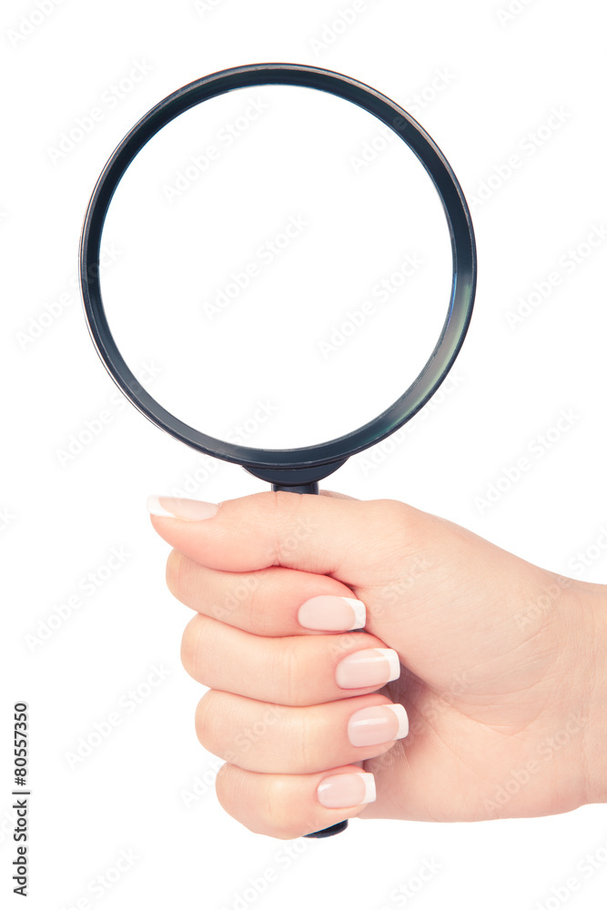 Hand holding magnifying glass on white backckground Hand holding magnifying glass on white backckground