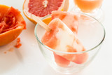 Homemade yogurt ice pops with fresh grapefruit juice