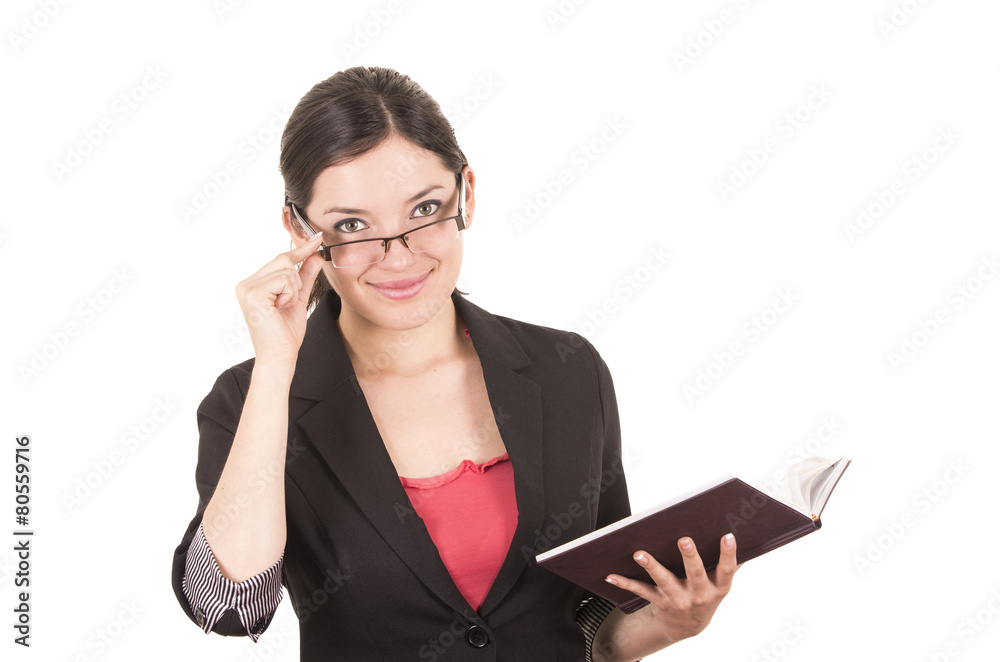 portrait of pretty female teacher wearing glasses and holding portrait of pretty female teacher wearing glasses and holding