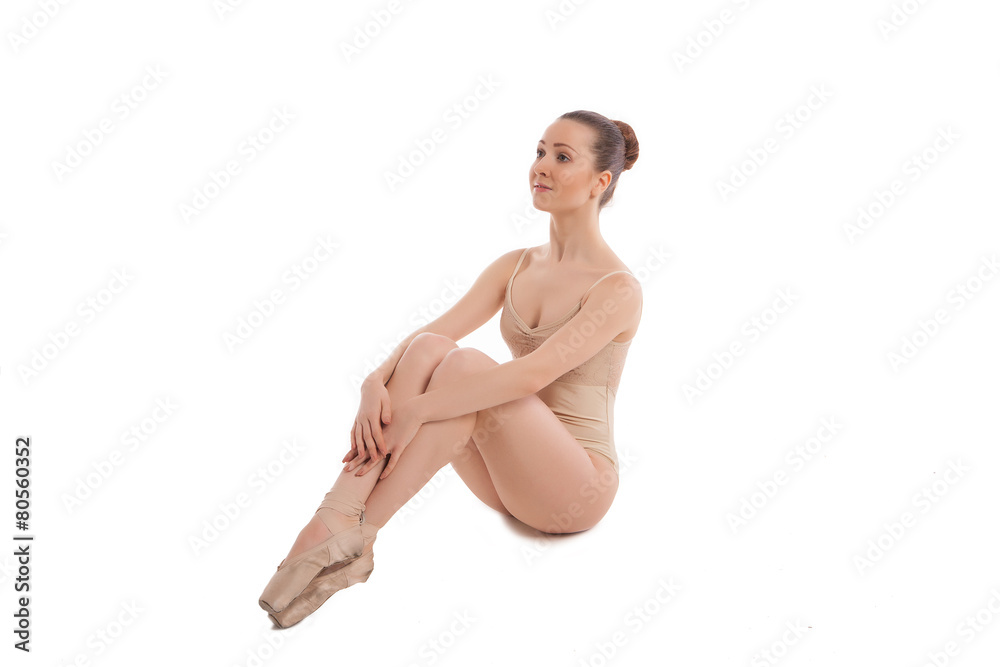 Fototapeta premium young pretty ballet dancer sitting in elegant pose