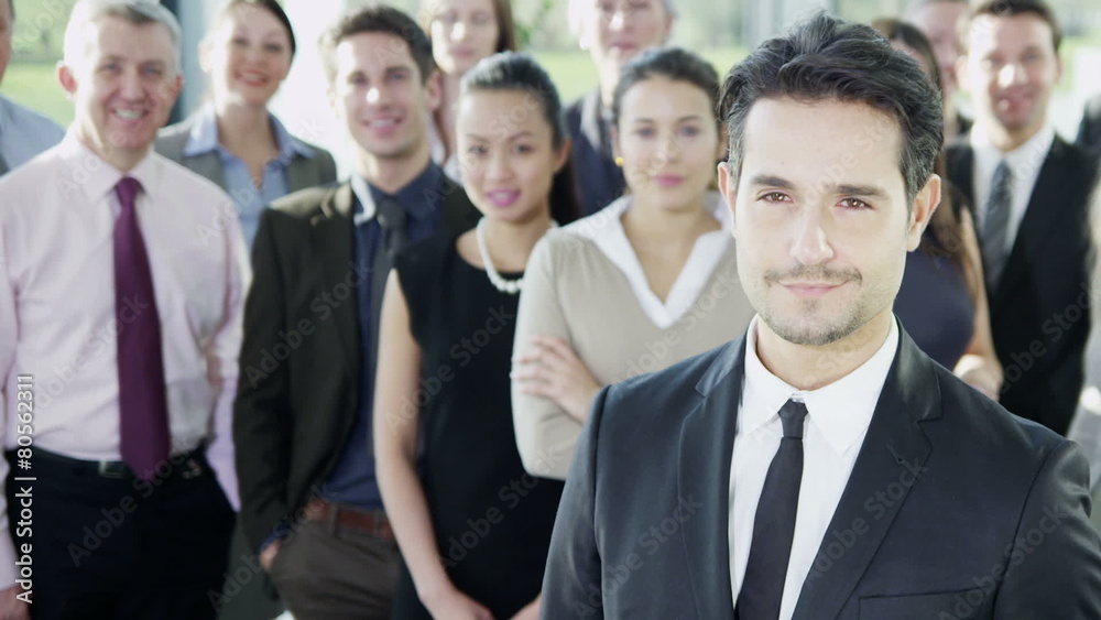 Attractive diverse business team in a light modern office building Attractive diverse business team in a light modern office building