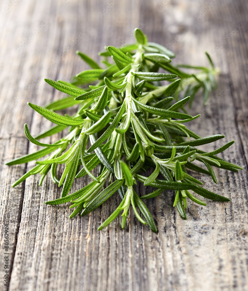 Rosemary on a wooden background Rosemary on a wooden background
