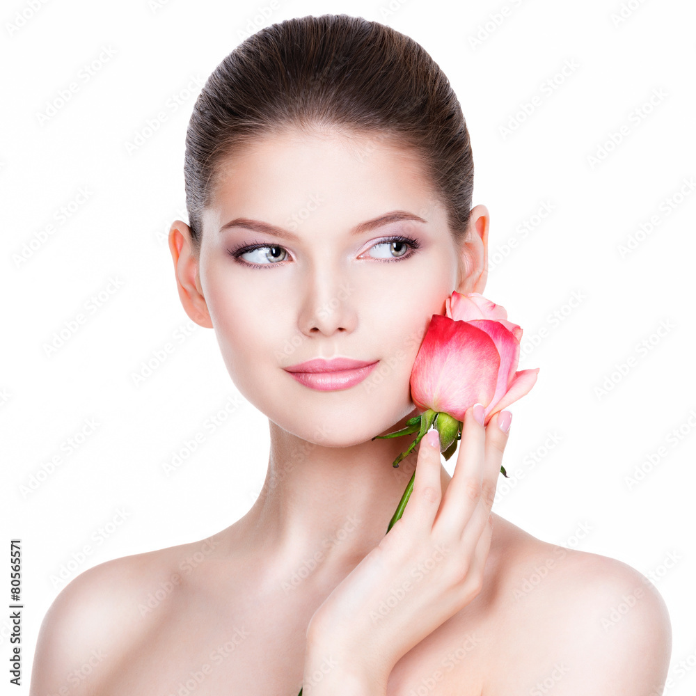 Beautiful young woman with pink rose. Beautiful young woman with pink rose.