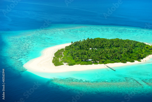 Beautiful tropical island from above. Maldives, Carribean or Sou photo