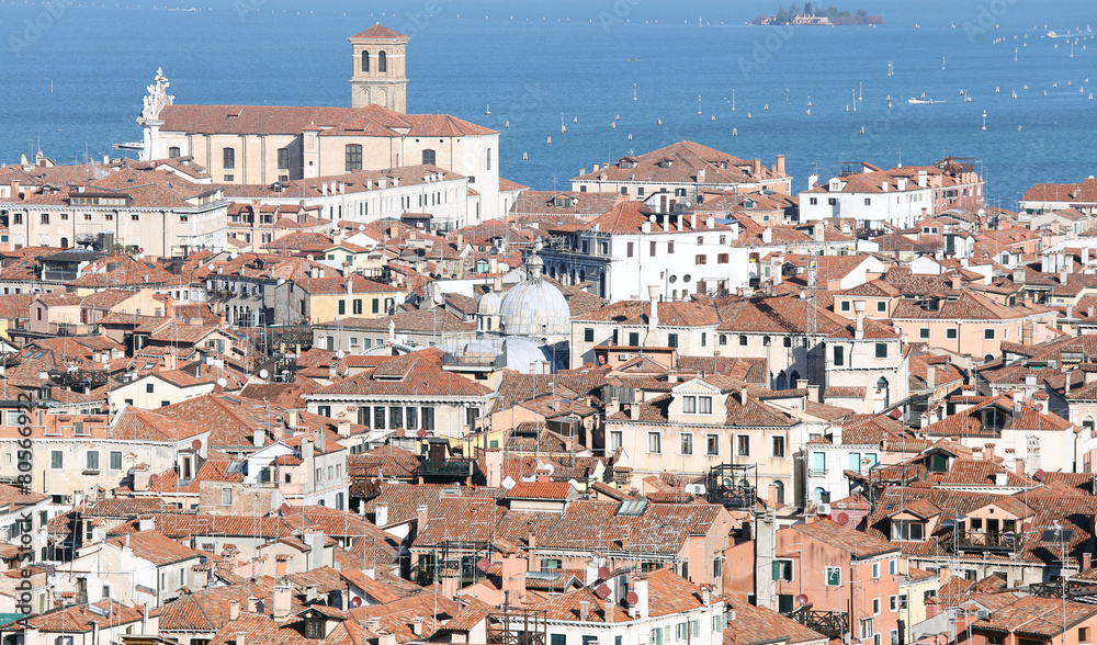 Venice, Italy, red-tiled roofs of the houses and the Church