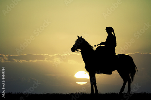 Horsewoman at sunset