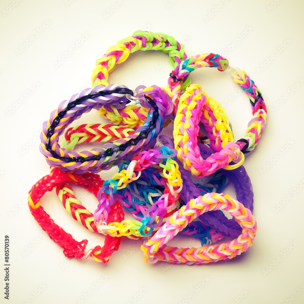 Group of colorful rubber band bracelets isolated on white Group of colorful rubber band bracelets isolated on white